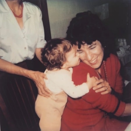 Natalie Herbick kissing her late mother when she a child. Is Fox 8 Natalie Married?
